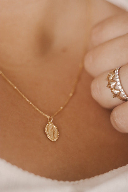 Intricate Miraculous medal necklace