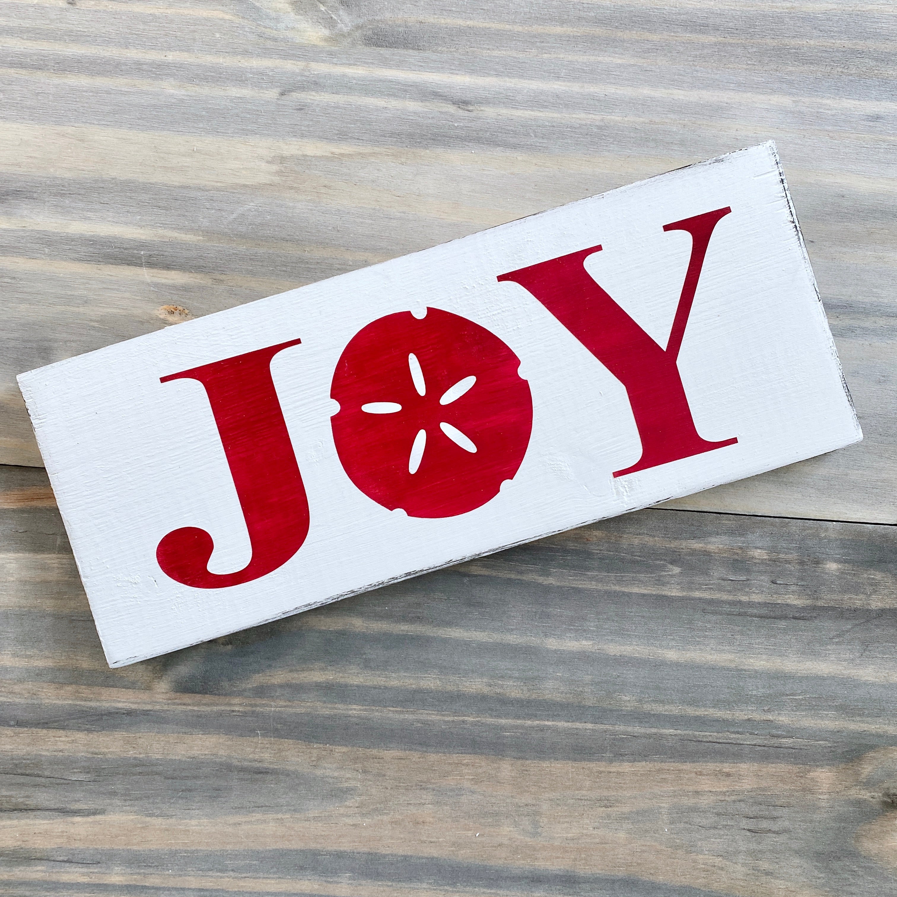 Joy Sand Dollar Sign