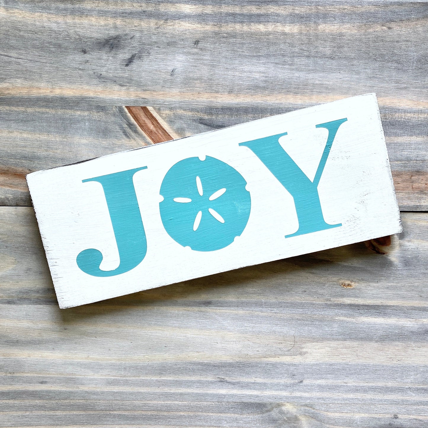 Joy Sand Dollar Sign