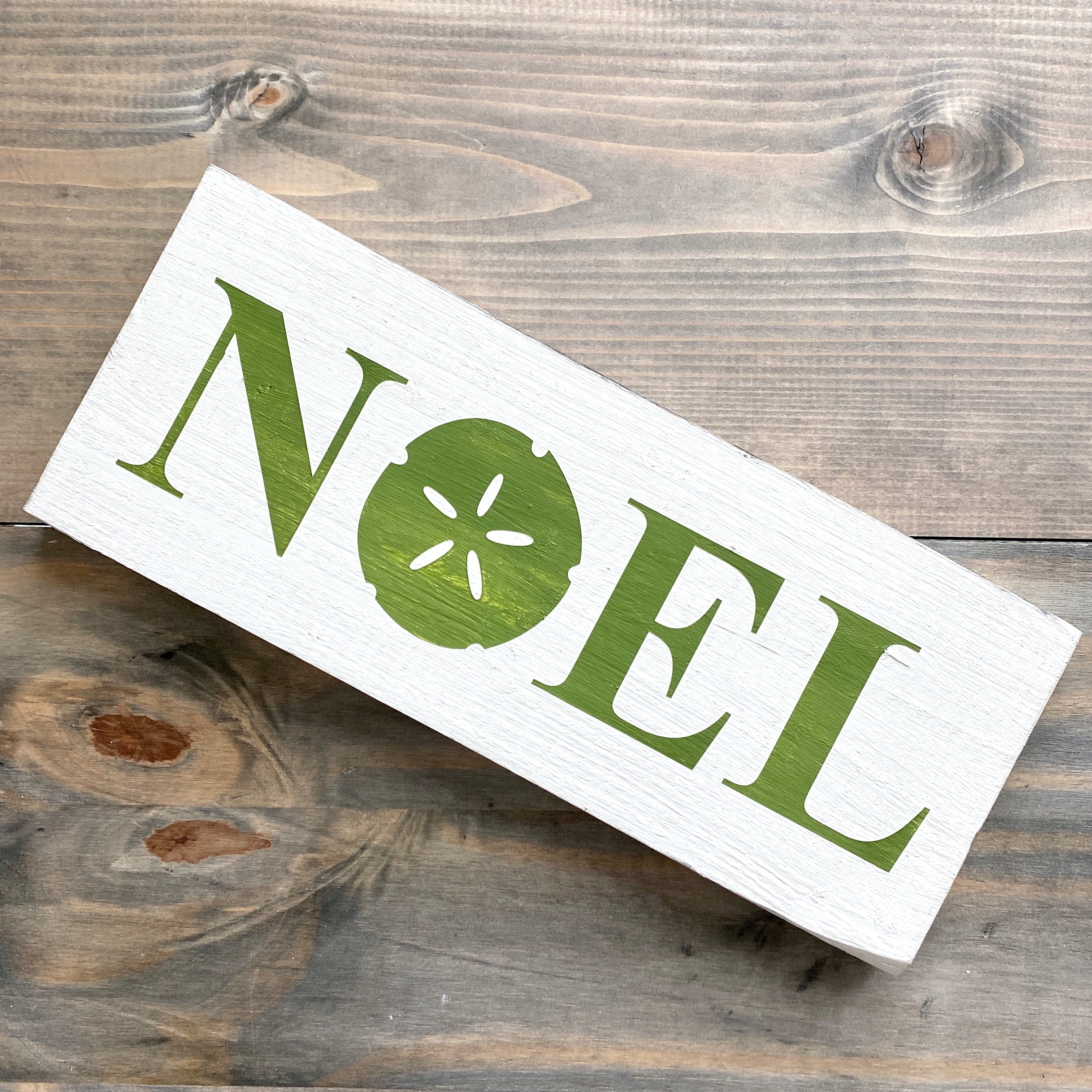 Noel Sand Dollar Sign