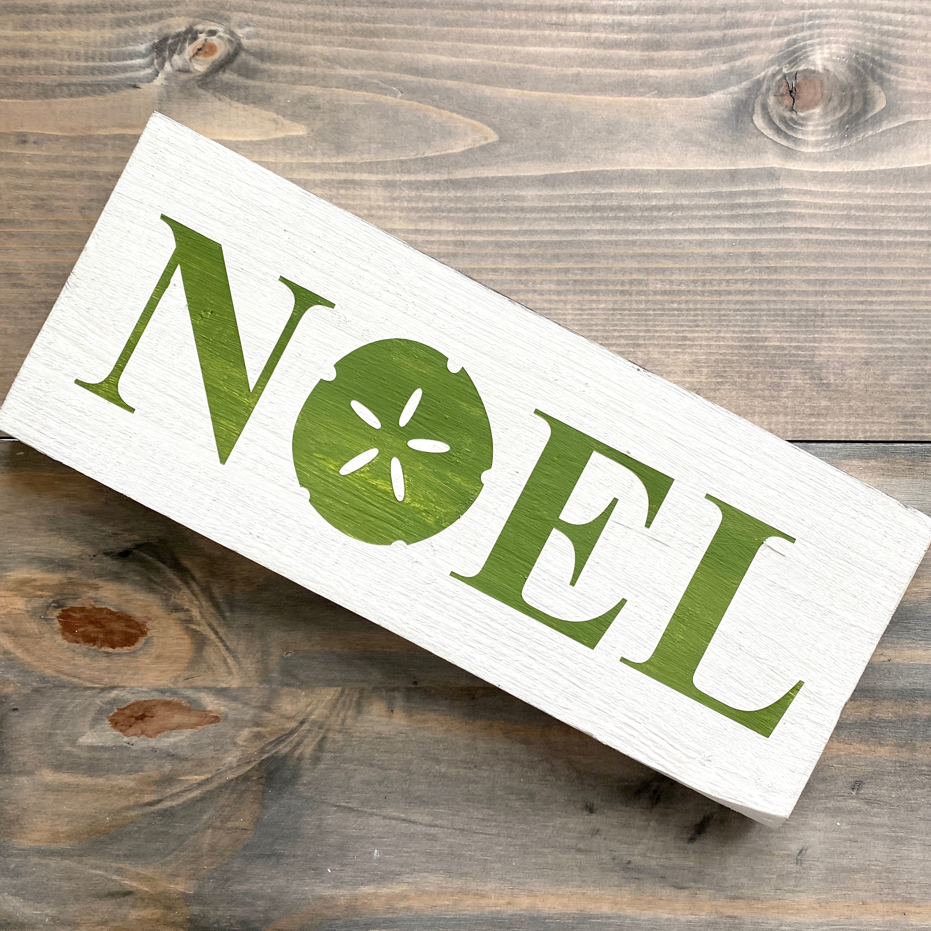 Noel Sand Dollar Sign