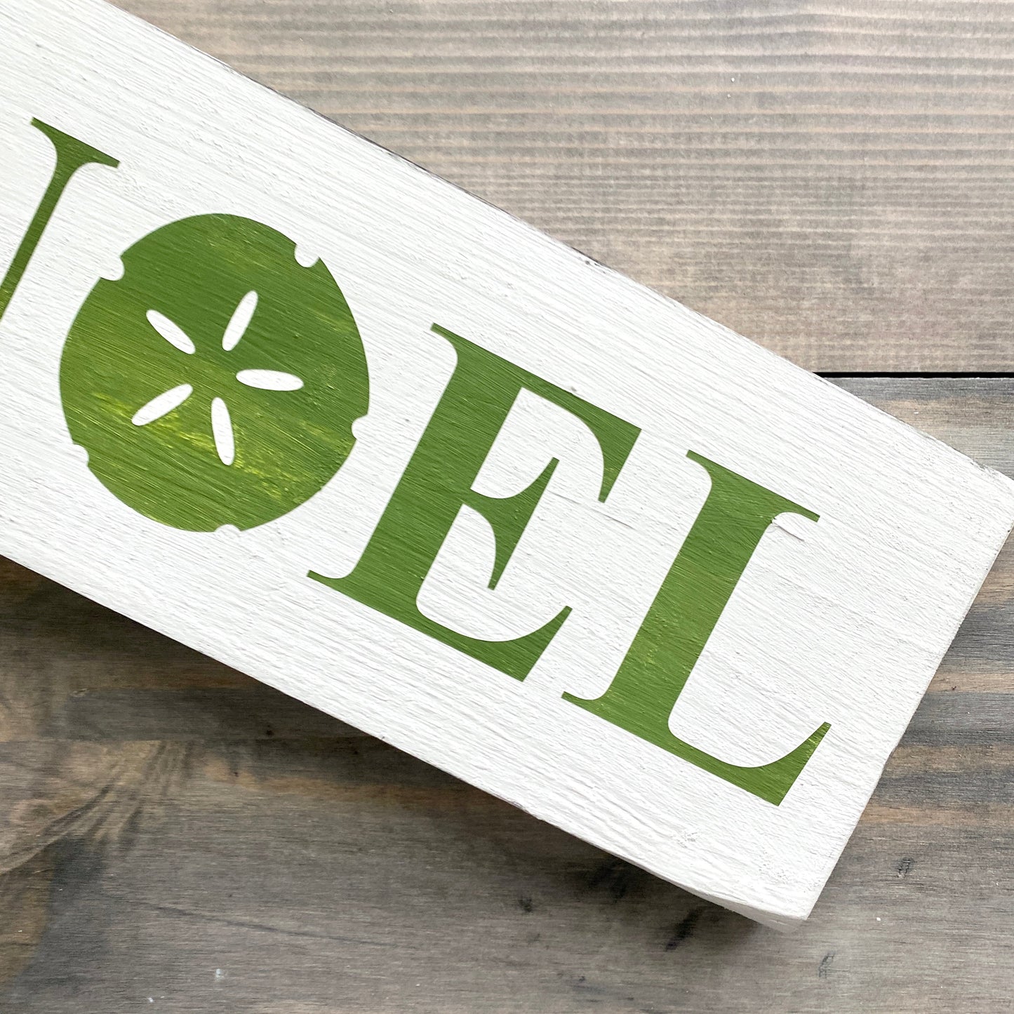 Noel Sand Dollar Sign