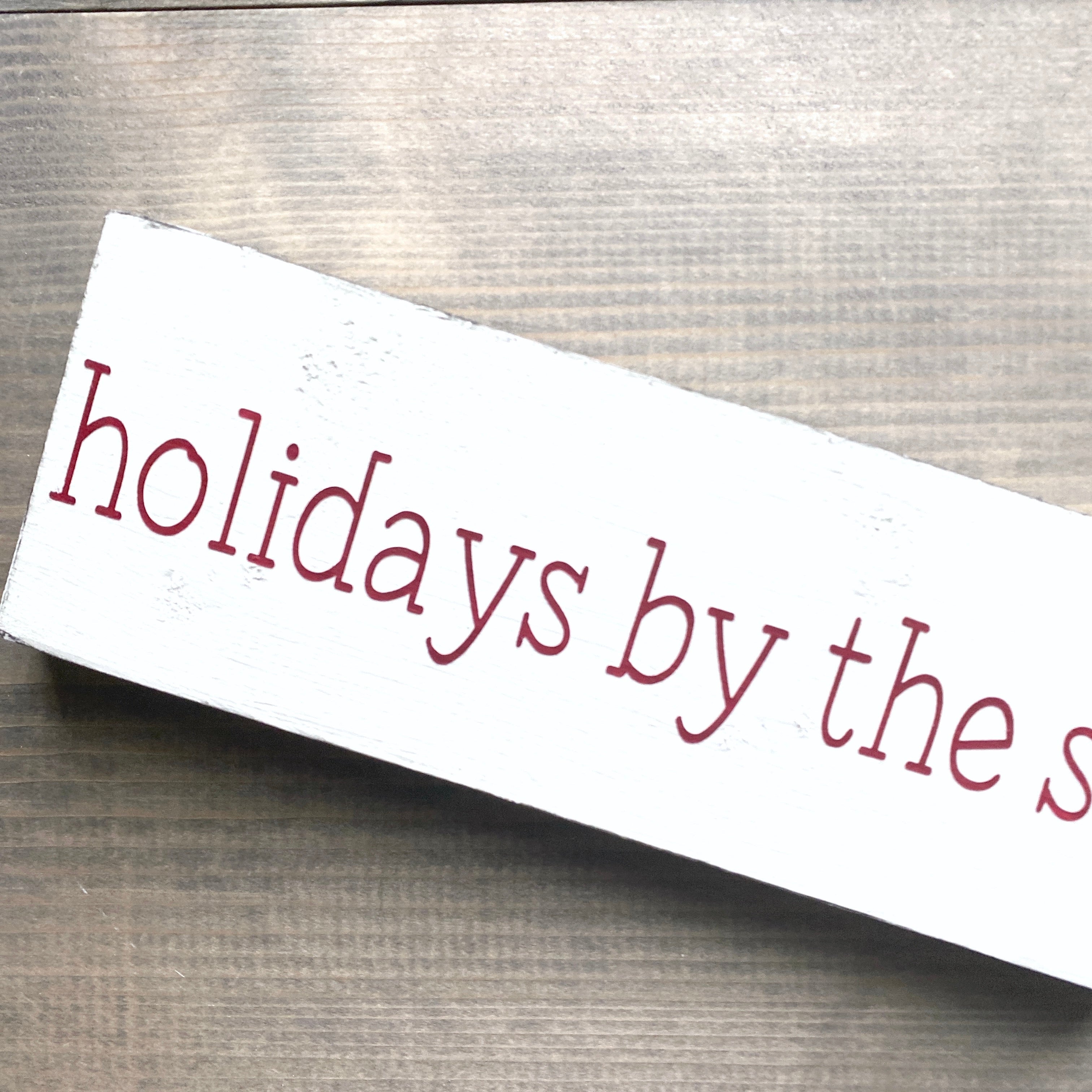 Holidays by the sea sign